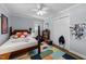 Bedroom featuring a playful rug, ample natural light, and a cozy beanbag chair at 1307 Crabapple Ln, Raleigh, NC 27607