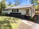 Charming single-story home with brick accents, landscaped beds, and a welcoming front entrance at 1307 Crabapple Ln, Raleigh, NC 27607