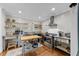 Modern kitchen featuring stainless steel appliances, open shelving, and hardwood floors at 1307 Crabapple Ln, Raleigh, NC 27607