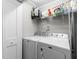 Functional laundry room with modern appliances and wire shelving for storage at 1307 Crabapple Ln, Raleigh, NC 27607