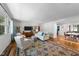 Spacious living room showcasing hardwood floors and an open layout to dining area at 1307 Crabapple Ln, Raleigh, NC 27607