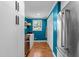 Bright pantry with ample storage space and stainless steel refrigerator at 1307 Crabapple Ln, Raleigh, NC 27607