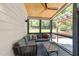 Covered patio with a comfortable seating area and a view of the backyard's landscaped yard at 1307 Crabapple Ln, Raleigh, NC 27607