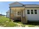 Exterior view of a home featuring a back porch and neutral-colored siding at 14 Cricket Hill Way, Benson, NC 27504