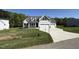 Beautiful two-story home with a three-car garage and manicured lawn at 14 Cricket Hill Way, Benson, NC 27504