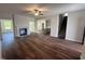 Open living space featuring hardwood floors, fireplace, and stairway at 14 Cricket Hill Way, Benson, NC 27504