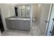 Main bath with double vanity, granite countertops, and a separate shower and toilet area at 14 Cricket Hill Way, Benson, NC 27504