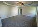 Large main bedroom boasting plush carpet, a ceiling fan, and ample natural light at 14 Cricket Hill Way, Benson, NC 27504