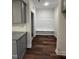 View of the mudroom showing built in bench with storage, and luxury vinyl flooring at 14 Cricket Hill Way, Benson, NC 27504