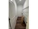 Walk-in pantry with ample shelving and hardwood floors at 14 Cricket Hill Way, Benson, NC 27504