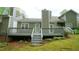 Spacious back deck with stairs leading to the backyard, perfect for outdoor entertaining at 1415 Quarter Pt, Raleigh, NC 27615