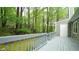 Lovely backyard view from deck surrounded by many large trees at 1415 Quarter Pt, Raleigh, NC 27615