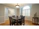 Elegant dining room with hardwood floors, ample natural light, and wainscoting at 1415 Quarter Pt, Raleigh, NC 27615