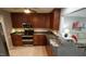 Modern kitchen with granite counters, stainless appliances, and ample cabinet space at 1415 Quarter Pt, Raleigh, NC 27615