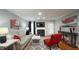Inviting living room featuring a fireplace, hardwood floors, and stylish decor at 1415 Quarter Pt, Raleigh, NC 27615