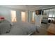 A stylish bedroom with mirrored closet doors and an en-suite bathroom at 1415 Quarter Pt, Raleigh, NC 27615