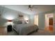 A comfortable bedroom with a ceiling fan, closet, and soft colors at 1415 Quarter Pt, Raleigh, NC 27615