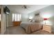 A relaxing bedroom featuring a ceiling fan, neutral colors, and a window at 1415 Quarter Pt, Raleigh, NC 27615