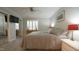 Comfortable bedroom featuring a ceiling fan, neutral colors, and soft window light at 1415 Quarter Pt, Raleigh, NC 27615