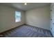Bedroom featuring neutral-colored walls, carpet, and a bright window at 152 Parker Ln, Mebane, NC 27302