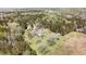 Expansive wooded property featuring multiple outbuildings and a vintage residence at 1556 Pleasants Rd, Wendell, NC 27591
