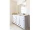 Bathroom featuring a white vanity with a marble countertop, and a large mirror at 1556 Pleasants Rd, Wendell, NC 27591