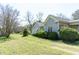 Two well-maintained clapboard homes with green roofs surrounded by lush greenery at 1556 Pleasants Rd, Wendell, NC 27591