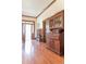 Hallway with wood floors, a large hutch and built in shelving at 1556 Pleasants Rd, Wendell, NC 27591