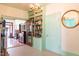 Hallway showcasing wood floors and built in shelving at 1556 Pleasants Rd, Wendell, NC 27591