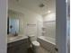 Clean bathroom featuring a shower-tub, single vanity sink, and neutral color scheme at 158 Parker Ln, Mebane, NC 27302
