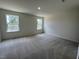 Bright bedroom with carpeting and natural light from windows at 158 Parker Ln, Mebane, NC 27302