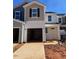 New townhome exteriors with garage and yard at 158 Parker Ln, Mebane, NC 27302