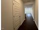 Hallway leading to living area with hardwood floors and plenty of natural light at 158 Parker Ln, Mebane, NC 27302