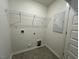 Laundry room with storage shelves and hookups at 158 Parker Ln, Mebane, NC 27302