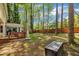 Lush backyard with a deck, wooded area, a shed, and a chest, all surrounded by a fence at 1600 S Wade Ave, Garner, NC 27529