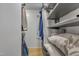 Walk-in closet features custom shelving, hanging rods, and ample space for organized wardrobe storage at 1600 S Wade Ave, Garner, NC 27529