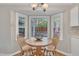Cozy dining area with warm wood finishes, natural light, and inviting views of the outdoor space at 1600 S Wade Ave, Garner, NC 27529