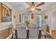 Traditional dining room boasts a wooden table, six chairs, and a ceiling fan for comfortable dining at 1600 S Wade Ave, Garner, NC 27529