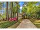 Beautiful yellow home with a charming porch and a long driveway at 1600 S Wade Ave, Garner, NC 27529