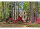 Charming yellow home with a cozy front porch and colorful landscaping at 1600 S Wade Ave, Garner, NC 27529