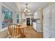 Bright kitchen featuring white cabinets, modern appliances, and a sunlit breakfast nook at 1600 S Wade Ave, Garner, NC 27529