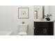 Comfortable bathroom featuring toilet, vanity, and decorative wall art at 1653 Goldfinch Perch Ln, Knightdale, NC 27545