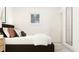 Serene bedroom featuring a comfortable bed, bright window, and a full length mirror at 1653 Goldfinch Perch Ln, Knightdale, NC 27545
