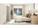 Bright bedroom featuring modern decor, side table, and a large window at 1653 Goldfinch Perch Ln, Knightdale, NC 27545
