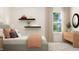 Stylish bedroom featuring modern decor, natural light, and accent shelving at 1653 Goldfinch Perch Ln, Knightdale, NC 27545