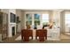 Elegant living room boasting large windows, a fireplace, and contemporary decor at 1653 Goldfinch Perch Ln, Knightdale, NC 27545