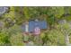 Overhead view of a home surrounded by lush greenery, showcasing a private setting at 1705 Lord Ashley Dr, Sanford, NC 27330