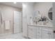 Bright bathroom showcasing double vanities, white cabinets, and mirrors at 1705 Lord Ashley Dr, Sanford, NC 27330