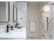 Bathroom featuring dual vanity, framed mirrors, and walk-in shower at 1705 Lord Ashley Dr, Sanford, NC 27330