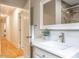 Bright bathroom features single sink vanity and a tile shower at 1705 Lord Ashley Dr, Sanford, NC 27330